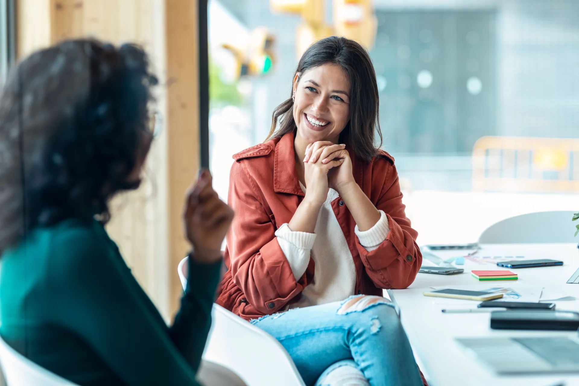 A coaching conversation in a bright workspace
